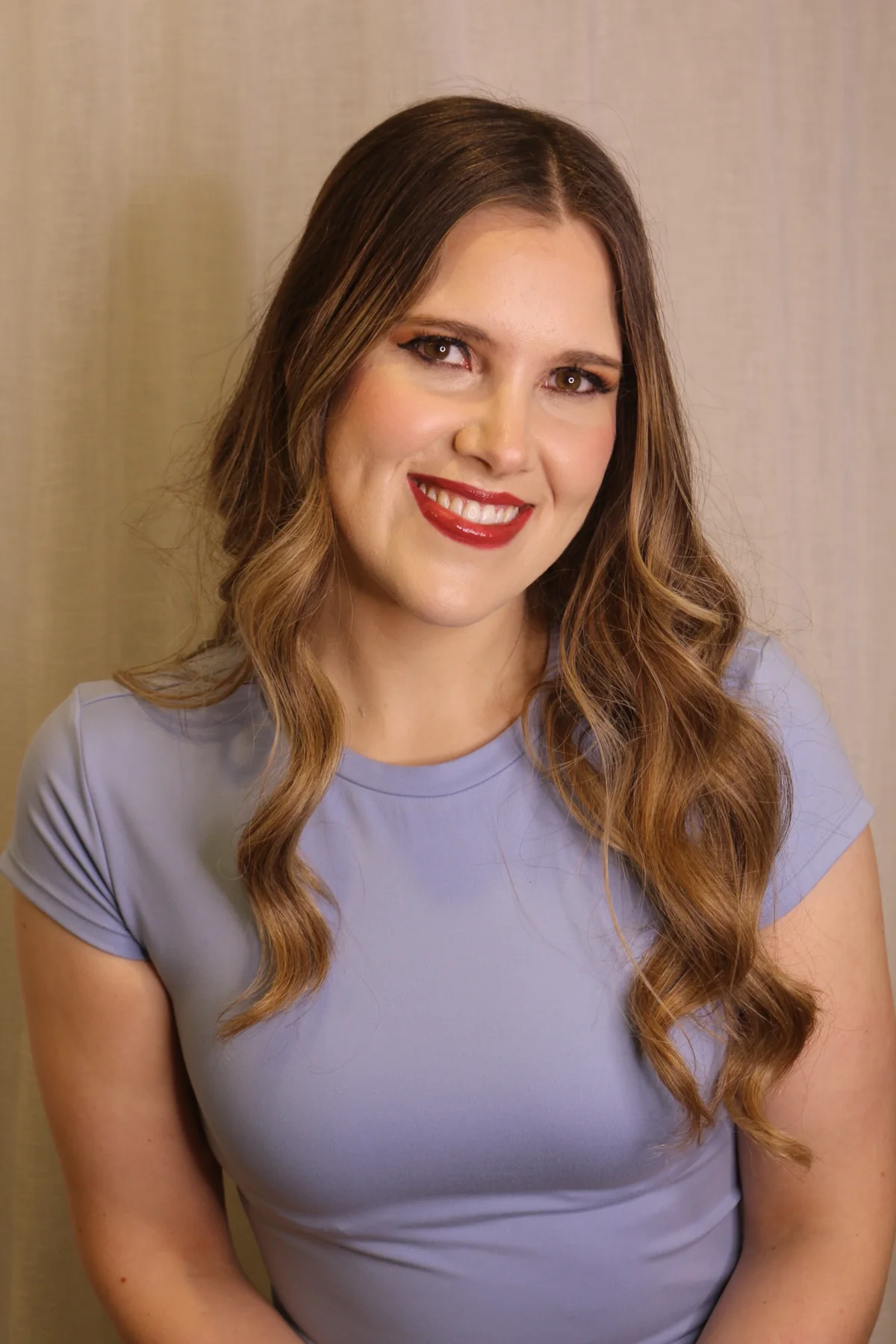 Polished soft glam makeup portrait with red lip